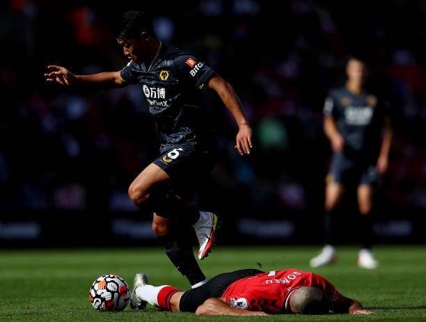 Oriol Romeu of Southampton is challenged by Hee-chan Hwang of Wolverhampton Wanderers during the Premier League match between Southampton and...