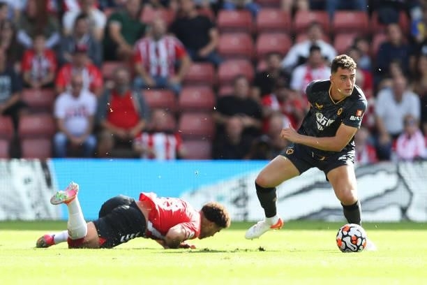 Maximilian Kilman of Wolverhampton Wanderers is challenged by Che Adams of Southampton during the Premier League match between Southampton and...