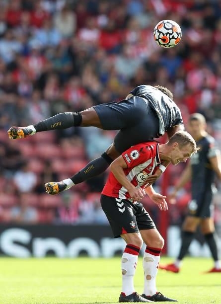 James Ward-Prowse of Southampton is challenged by Adama Traore of Wolverhampton Wanderers during the Premier League match between Southampton and...