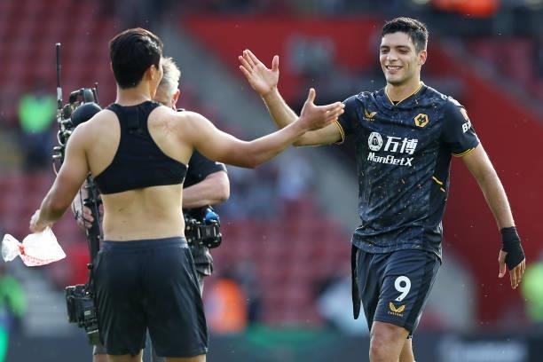 Raul Jimenez of Wolverhampton Wanderers shakes hands with Hee-chan Hwang of Wolverhampton Wanderers following victory in the Premier League match...