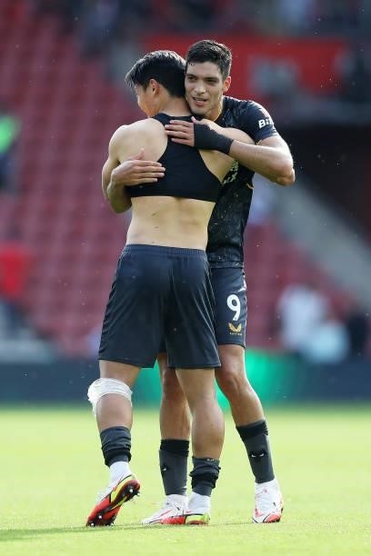 Raul Jimenez of Wolverhampton Wanderers hugs Hee-chan Hwang of Wolverhampton Wanderers following victory in the Premier League match between...