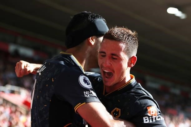 Raul Jimenez of Wolverhampton Wanderers celebrates with Daniel Podence after scoring his team's first goal during the Premier League match between...