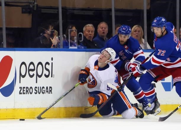 Barclay Goodrow of the New York Rangers takes a five minute boarding penalty against Kyle MacLean of the New York Islanders in a preseason game at...