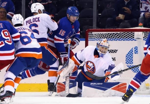 Ilya Sorokin of the New York Islanders makes the first period save as Julien Gauthier of the New York Rangers looks for the rebound in a preseason...