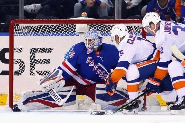 Cal Clutterbuck of the New York Islanders scores a second period goal against Alexandar Georgiev of the New York Rangers in a preseason game at...