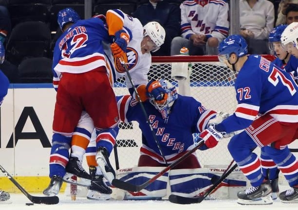 Patrik Nemeth and Alexandar Georgiev of the New York Rangers defend against Kieffer Bellows of the New York Islanders during the second period in a...