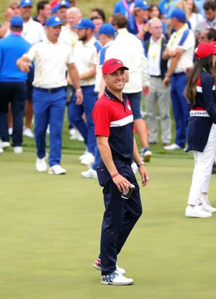 Justin Thomas of team United States celebrates on the on the 18th green after defeating Team Europe 19 to 9 to win the 43rd Ryder Cup at Whistling...