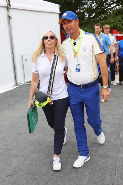 Captain Padraig Harrington of Ireland and team Europe walks with his wife Caroline Harrington after their 19 to 9 loss to Team United States during...