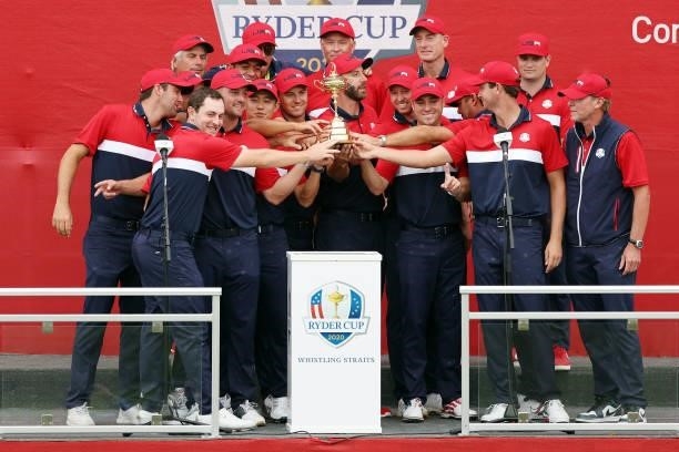 Team United States celebrates with the Ryder Cup after defeating Team Europe 19 to 9 during Sunday Singles Matches of the 43rd Ryder Cup at Whistling...