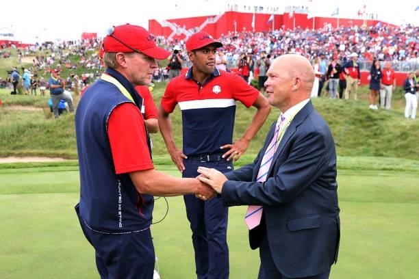 Captain Steve Stricker of team United States shakes hands with European Ryder Cup Director Guy Kinnings after winning the 43rd Ryder Cup at Whistling...