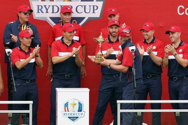 Team United States celebrates with the Ryder Cup after defeating Team Europe 19 to 9 during Sunday Singles Matches of the 43rd Ryder Cup at Whistling...