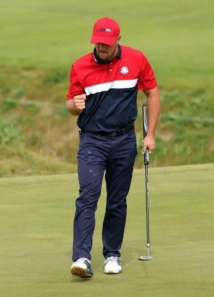 Bryson DeChambeau of team United States reacts to a putt on the on the ninth green during Sunday Singles Matches of the 43rd Ryder Cup at Whistling...