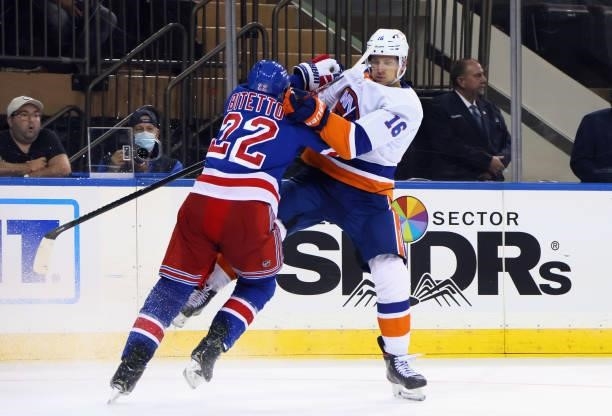 Anthony Bitetto of the New York Rangers holds up Richard Panik of the New York Islanders during the third period in a preseason game at Madison...