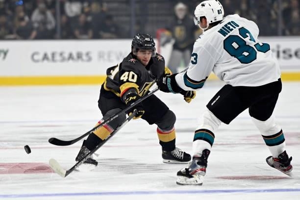 Lukas Cormier of the Vegas Golden Knights battles Matt Nieto of the San Jose Sharks during the first period at T-Mobile Arena on September 26, 2021...