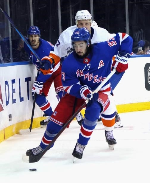 Mika Zibanejad of the New York Rangers skates against the New York Islanders in a preseason game at Madison Square Garden on September 26, 2021 in...