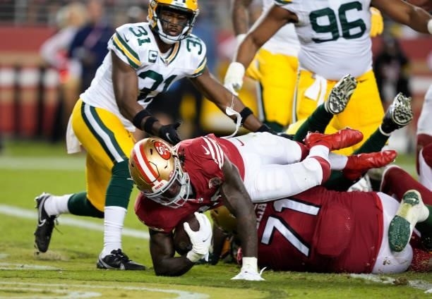Trey Sermon of the San Francisco 49ers dives for a touchdown during the second half against the Green Bay Packers in the game at Levi's Stadium on...