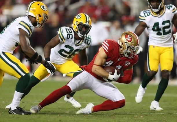 Kyle Juszczyk of the San Francisco 49ers runs after catching a pass during the second half against the Green Bay Packers in the game at Levi's...