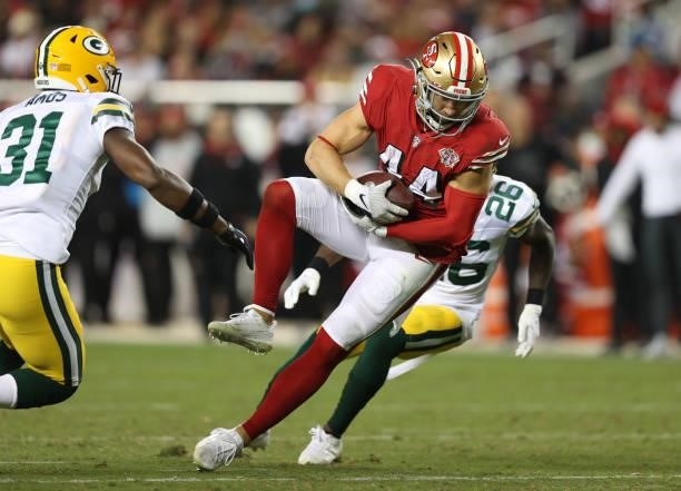 Kyle Juszczyk of the San Francisco 49ers runs after catching a pass during the second half against the Green Bay Packers in the game at Levi's...