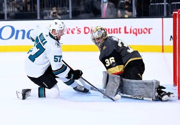 Logan Thompson of the Vegas Golden Knights makes a save against Adam Raska of the San Jose Sharks during the second period at T-Mobile Arena on...