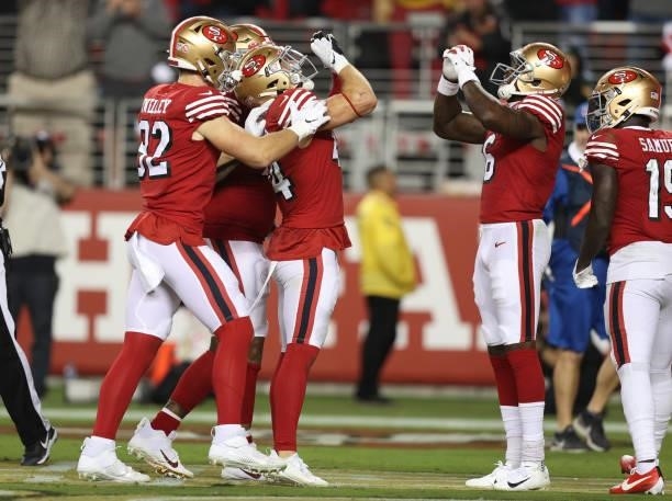 Kyle Juszczyk of the San Francisco 49ers celebrates after scoring a touchdown during the fourth quarter against the Green Bay Packers in the game at...