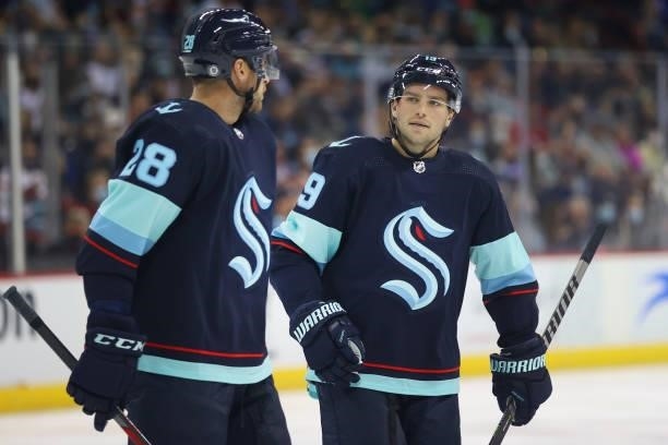 Carson Soucy and Calle Jarnkrok of the Seattle Kraken talk in the first period during a preseason game at Spokane Veterans Memorial Arena on...