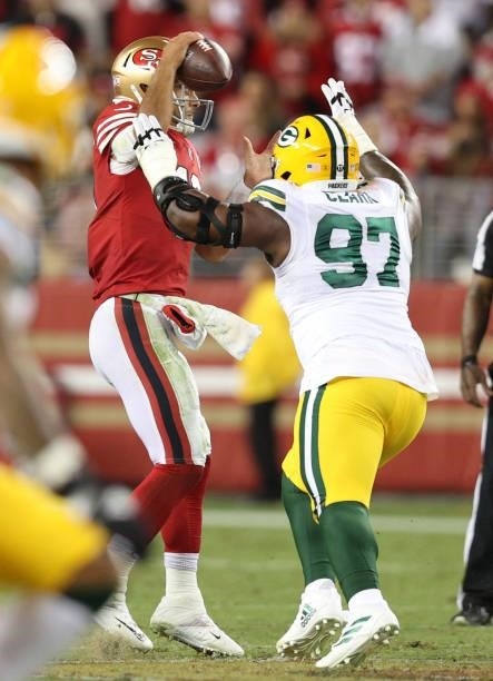 Kenny Clark of the Green Bay Packers rushes Jimmy Garoppolo of the San Francisco 49ers forcing a fumble during the fourth quarter in the game at...
