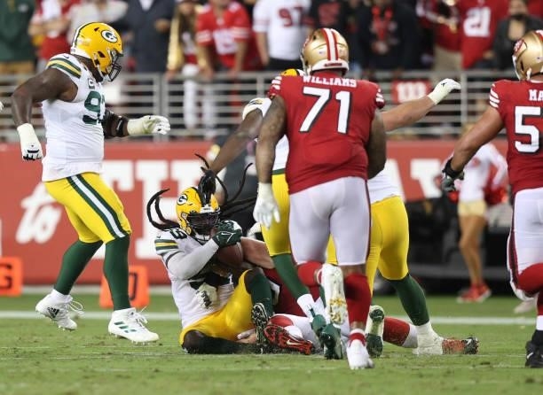 De'Vondre Campbell of the Green Bay Packers recovers a fumble by Jimmy Garoppolo of the San Francisco 49ers during the fourth quarter in the game at...