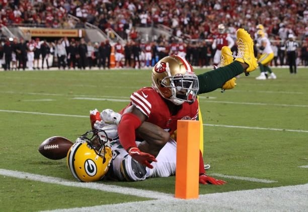 Emmanuel Moseley of the San Francisco 49ers breaks up a pass to Davante Adams of the Green Bay Packers during the fourth quarter in the game at...