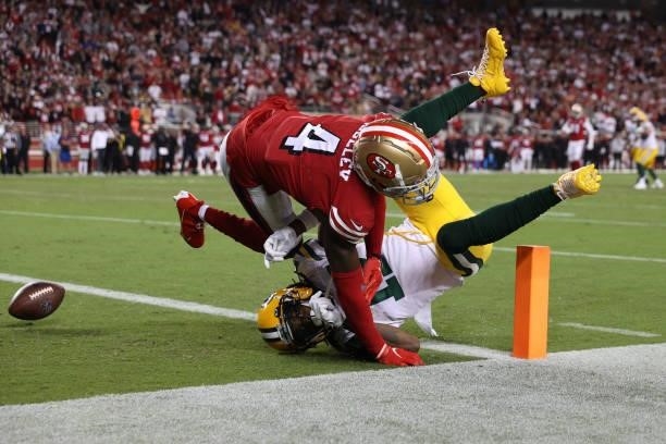 Emmanuel Moseley of the San Francisco 49ers breaks up a pass to Davante Adams of the Green Bay Packers during the fourth quarter in the game at...