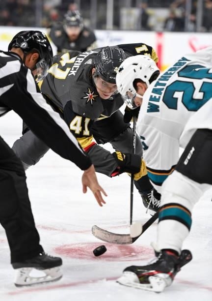 Nolan Patrick of the Vegas Golden Knights faces off with Jasper Weatherby of the San Jose Sharks during the third period at T-Mobile Arena on...
