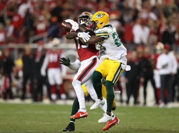 Darnell Savage of the Green Bay Packers breaks up a pass to Deebo Samuel of the San Francisco 49ers during the fourth quarter in the game at Levi's...