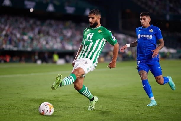 Nabil Fekir of Real Betis competes for the ball with Mathias Olivera of Getafe CF during the LaLiga Santander match between Real Betis and Getafe CF...