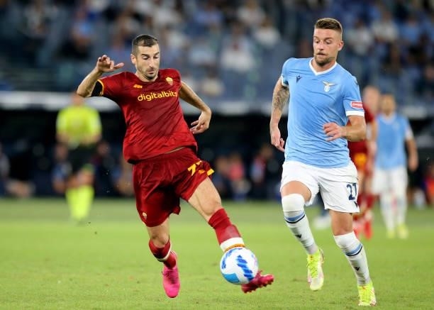 Henrik Mkhitaryan of AS Roma competes for the ball with Sergej Milinkovic-Savic of SS Lazio ,during the Serie A match between SS Lazio and AS Roma at...