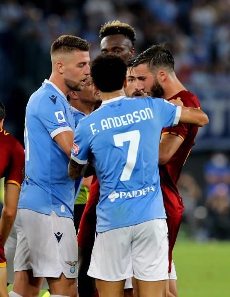 Bryan Cristante of AS Roma argues with Sergej Milinkovic-Savic and Felipe Anderson of SS Lazio ,during the Serie A match between SS Lazio and AS Roma...