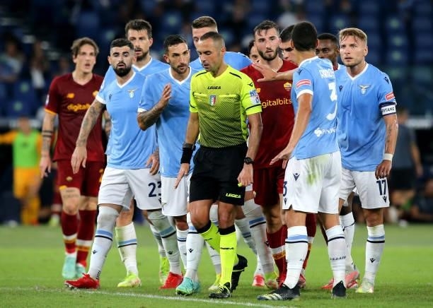 Lazio players argues with Italian Referee Marco Guida ,during the Serie A match between SS Lazio and AS Roma at Stadio Olimpico on September 26, 2021...