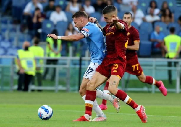 Ciro Immobile of SS Lazio competes for the ball with Gianluca Mancini of AS Roma ,during the Serie A match between SS Lazio and AS Roma at Stadio...