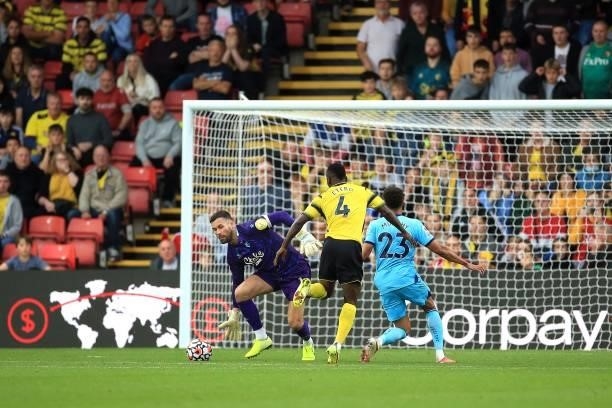 Ben Foster of Watford saves at the feet of Jacob Murphy of Newcastle United during the Premier League match between Watford and Newcastle United at...
