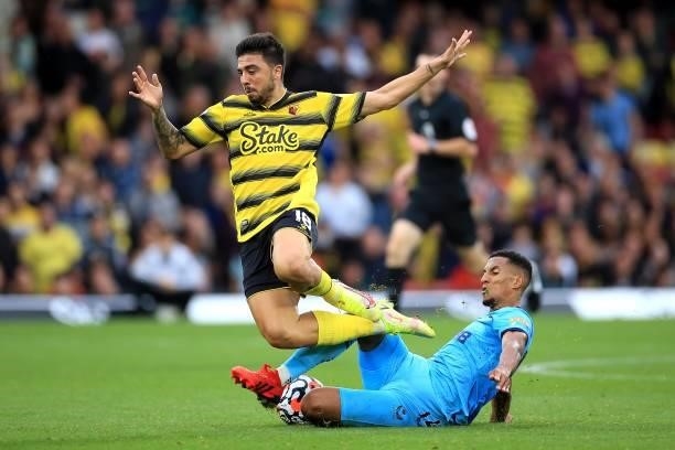 Isaac Hayden of Newcastle United and Ozan Tufan of Watford during the Premier League match between Watford and Newcastle United at Vicarage Road on...