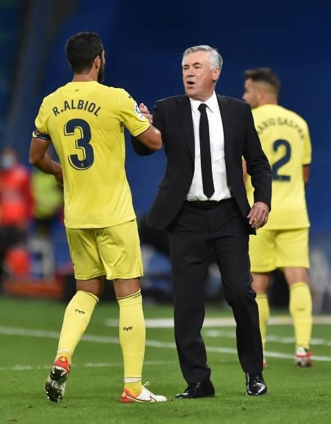 Carlo Ancelotti, head coach of Real Madrid greets Raul Albiol of Villareal FC at the end the La Liga Santander match between Real Madrid CF and...
