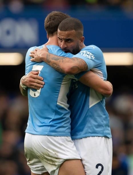 Rúben Dias and Kyle Walker of Manchester City embrace after the Premier League match between Chelsea and Manchester City at Stamford Bridge on...