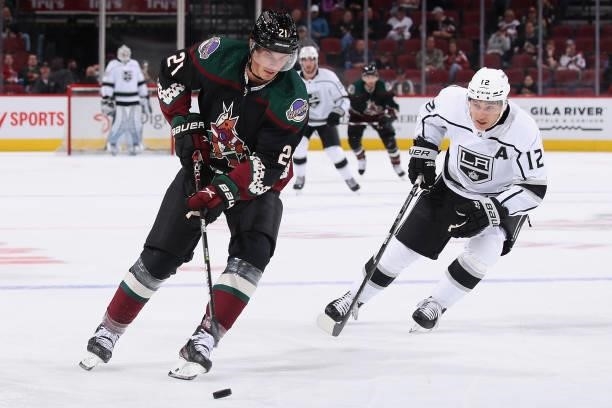 Loui Eriksson of the Arizona Coyotes skates with the puck ahead of Trevor Moore of the Los Angeles Kings during the first period of the preseason NHL...