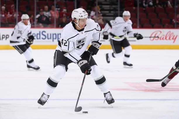 Martin Chromiak of the Los Angeles Kings skates with the puck during the first period of the preseason NHL game against the Arizona Coyotes at Gila...