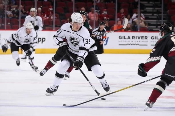 Alex Turcotte of the Los Angeles Kings skates with the puck during the first period of the preseason NHL game against the Arizona Coyotes at Gila...