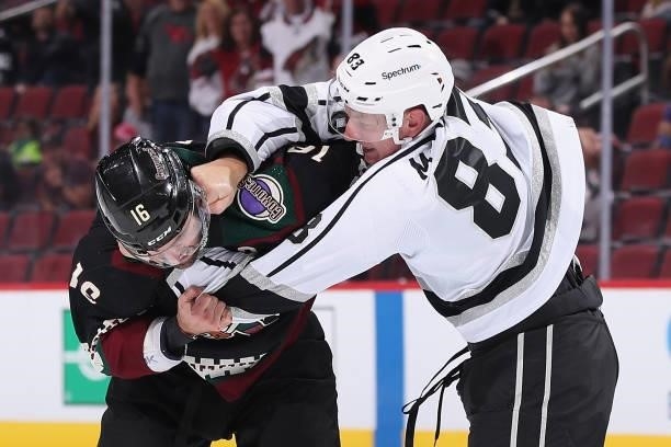 Cade McNelly of the Los Angeles Kings throws a punch on Andrew Ladd of the Arizona Coyotes during a fight in the second period of the preseason NHL...