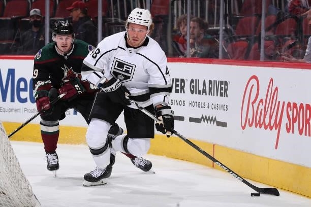 Brendan Lemieux of the Los Angeles Kings skates with the puck ahead of Ty Emberson of the Arizona Coyotes during the third period of the preseason...
