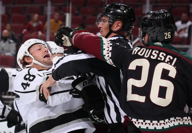 Brendan Lemieux of the Los Angeles Kings avoids a punch from Antoine Roussel of the Arizona Coyotes during the second period of the preseason NHL...