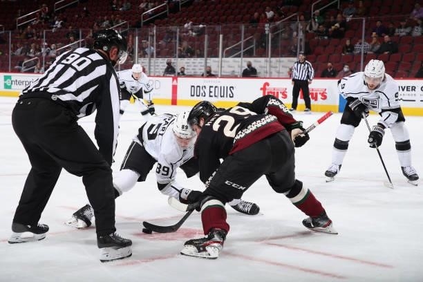 Rasmus Kupari of the Los Angeles Kings faces off against Barrett Hayton of the Arizona Coyotes during the second period of the preseason NHL game at...