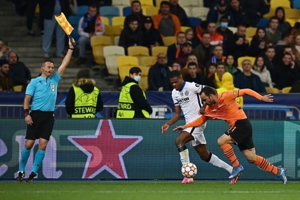 Denzel Dumfries of FC Internazionale battles for possession with Ismaily of Shakhtar Donetsk during the UEFA Champions League group D match between...