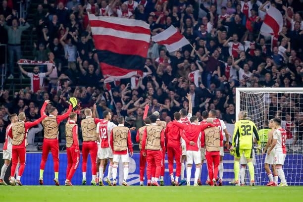 Players of Ajax celebrate the victory with the fans during the UEFA Champions League Group stage match between Ajax and Besiktas at Johan Cruijff...