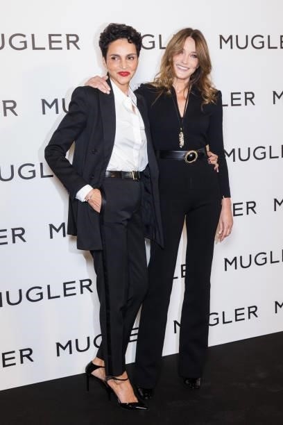 Farida Khelfa and Carla Bruni attend the "Thierry Mugler : Couturissime